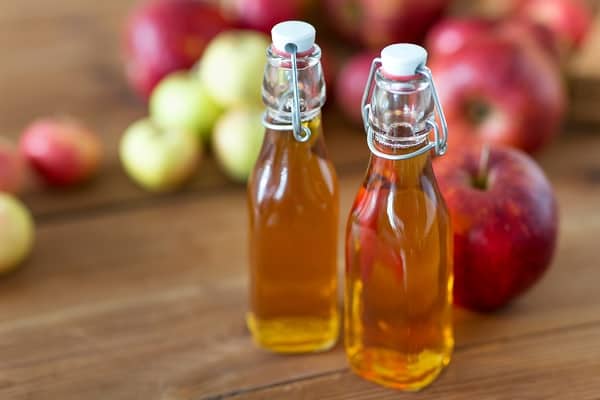 Glass bottles of apple cider vinegar